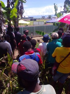 Tickets sold out and forced these people to stand outside find every space to watce the 6th PNG Games in Lae