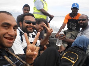 Lae media officers on a field trip to Yambo on a motor powered speed 